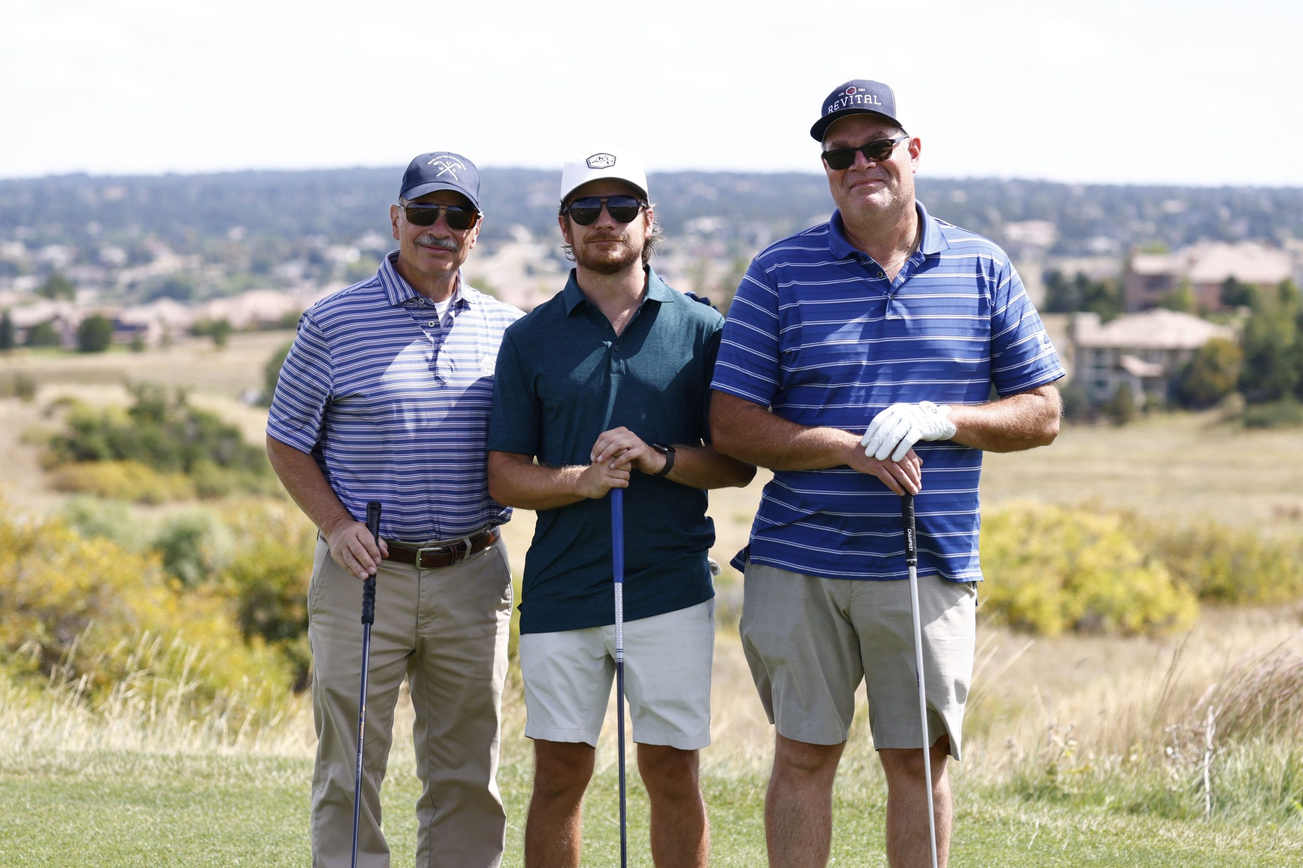 _G5A9181_2560x1706 Three golfers standing side by side smile