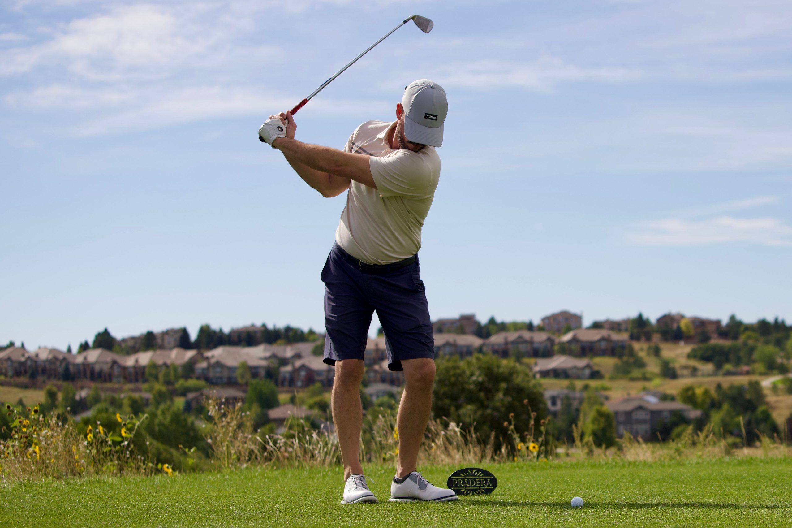 A golfer swings his club