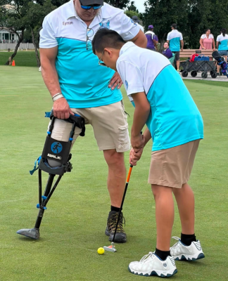 Michael with his father playing golf