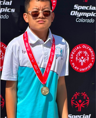 Michael wearing a medal